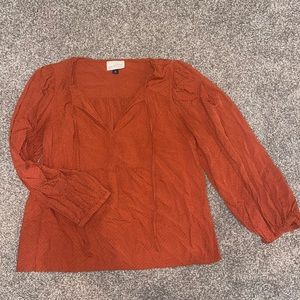 Burnt orange long sleeve blouse.